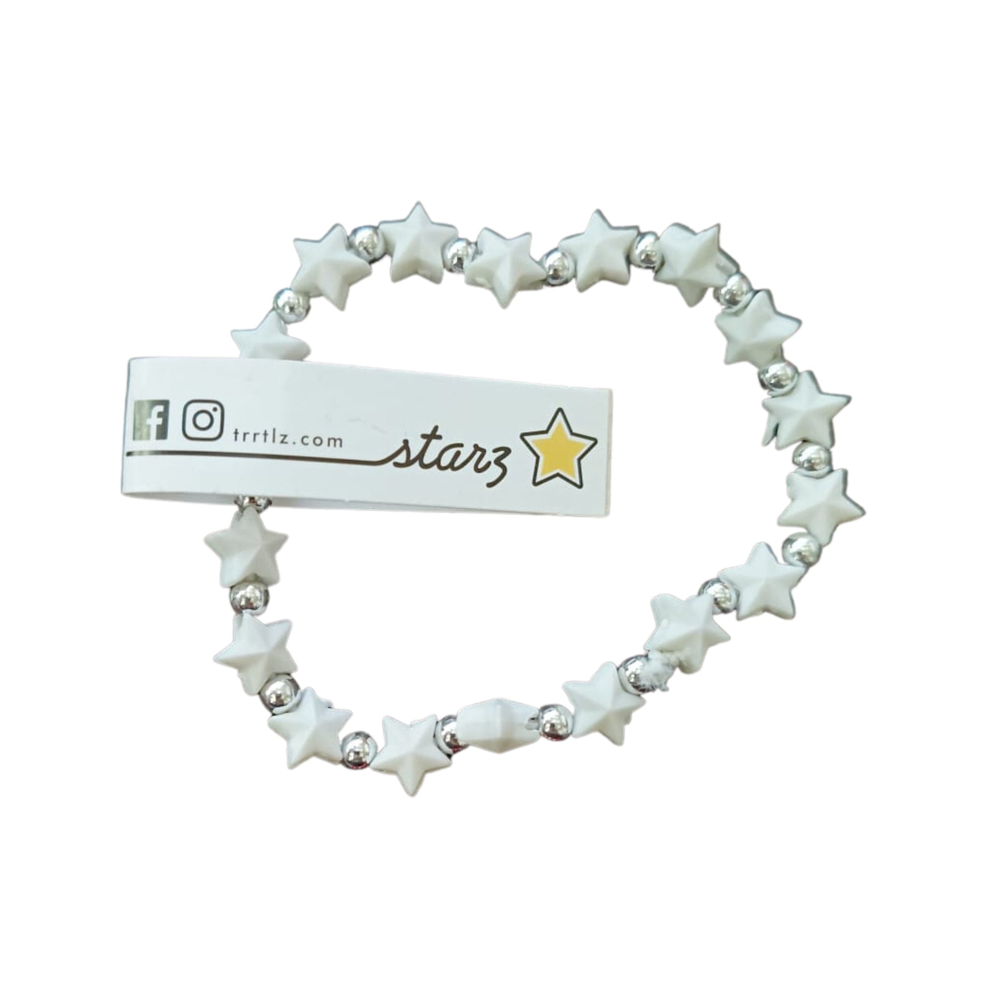 Dettaglio braccialetti Starz stellina colori pastello e fluorescenti su polso